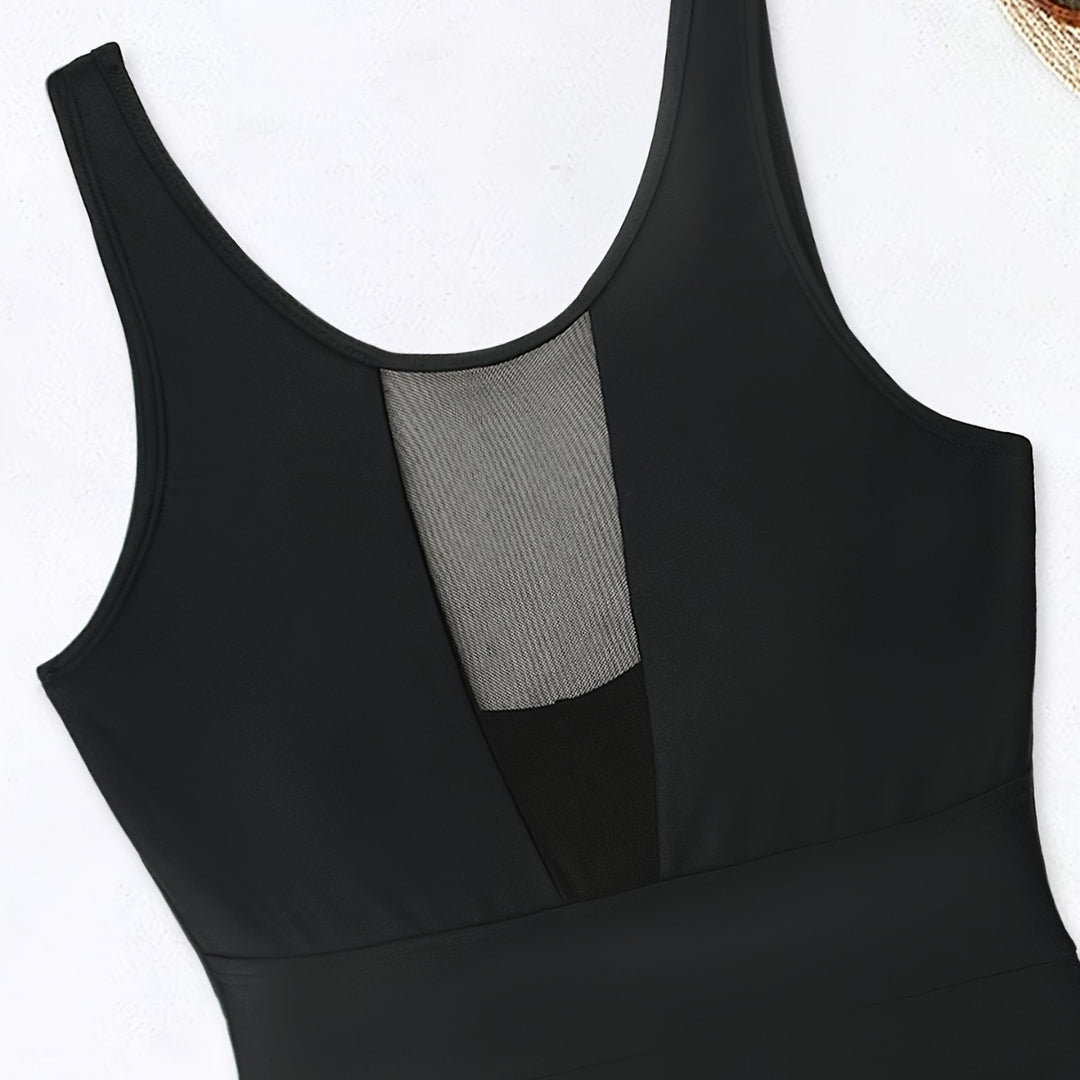 Women’s sporty jumpsuit with deep V-neckline and transparent mesh details Mune Fashion
