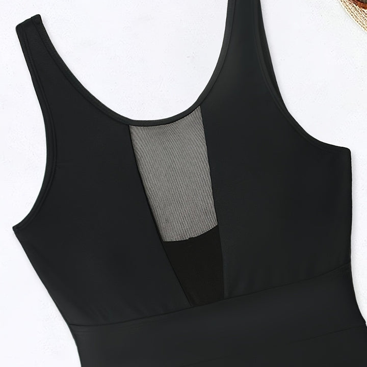 Women’s sporty jumpsuit with deep V-neckline and transparent mesh details Mune Fashion