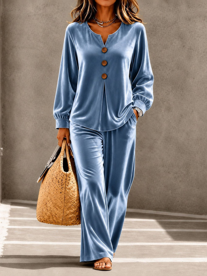Women in soft velvet lounge set with V-neck, button placket, and wide leg Mune Fashion