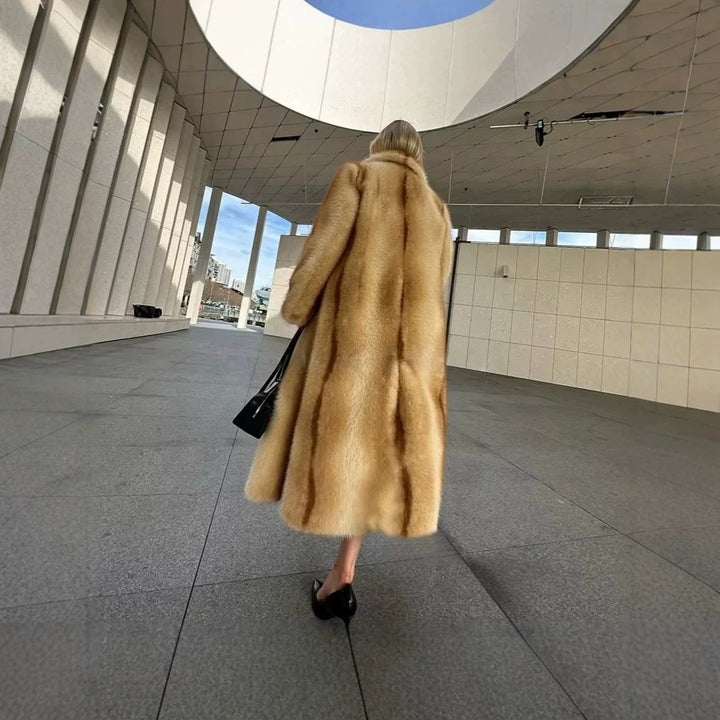 Women’s longer luxurious fur coat with wide lapels and concealed button placket Mune Fashion