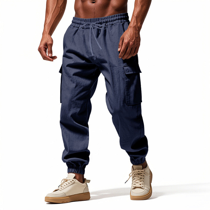 Men's tapered joggers in utilitarian style with elastic waistband, drawstring, and flap pockets Mune Fashion