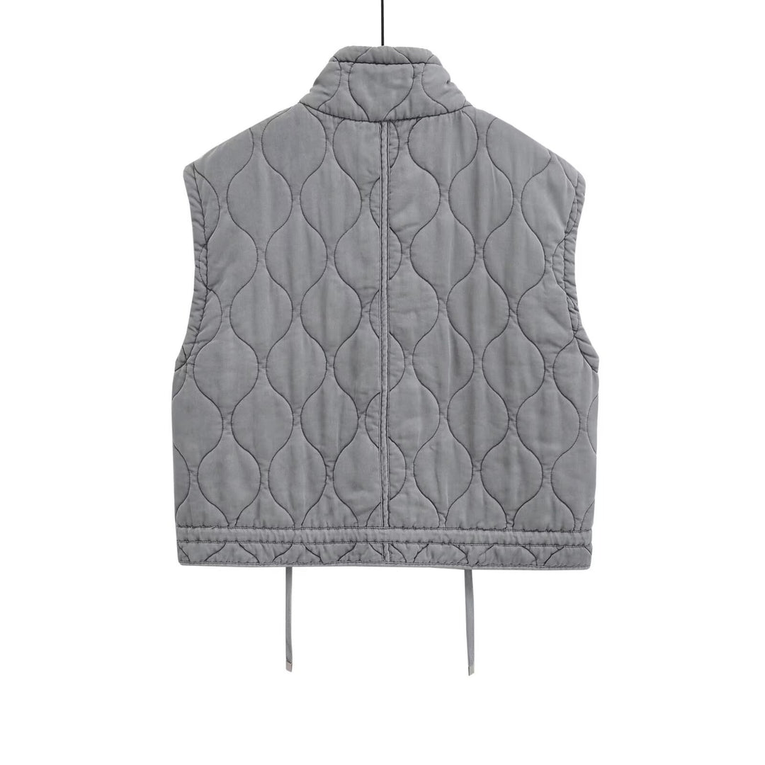 Women 100+ quilted utility vest with stand-up collar, drawstring hem, and patch pockets Mune Fashion