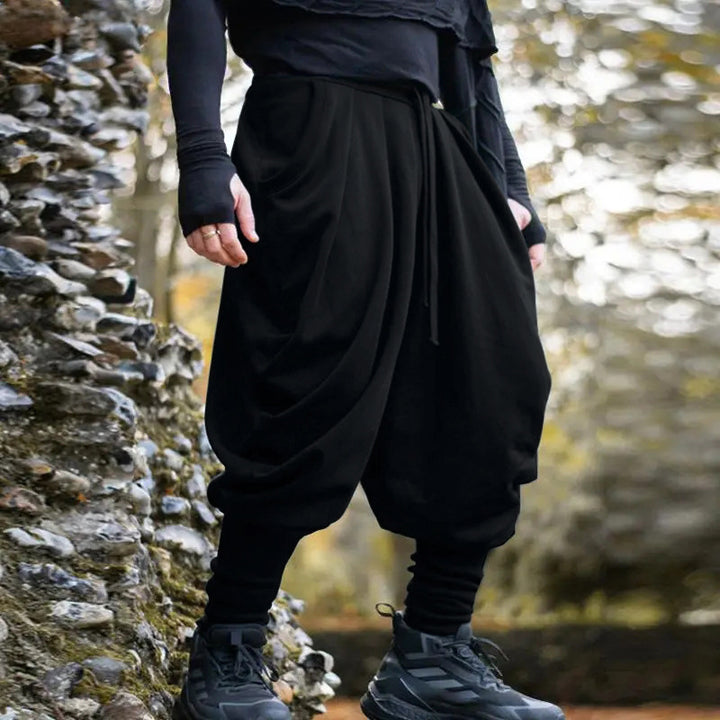 Men's avant-garde harem pants with wrap front, elastic waistband, and slim ankles Mune Fashion