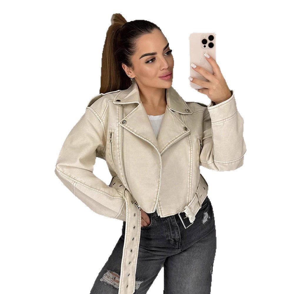 Women's short biker jacket made of vegan leather with a wide waist belt and visible decorative stitching Mune Fashion
