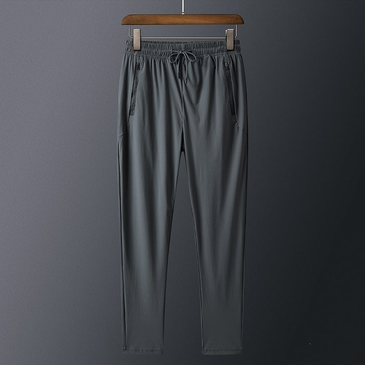 Men's sporty training pants with practical zip pockets Mune Fashion