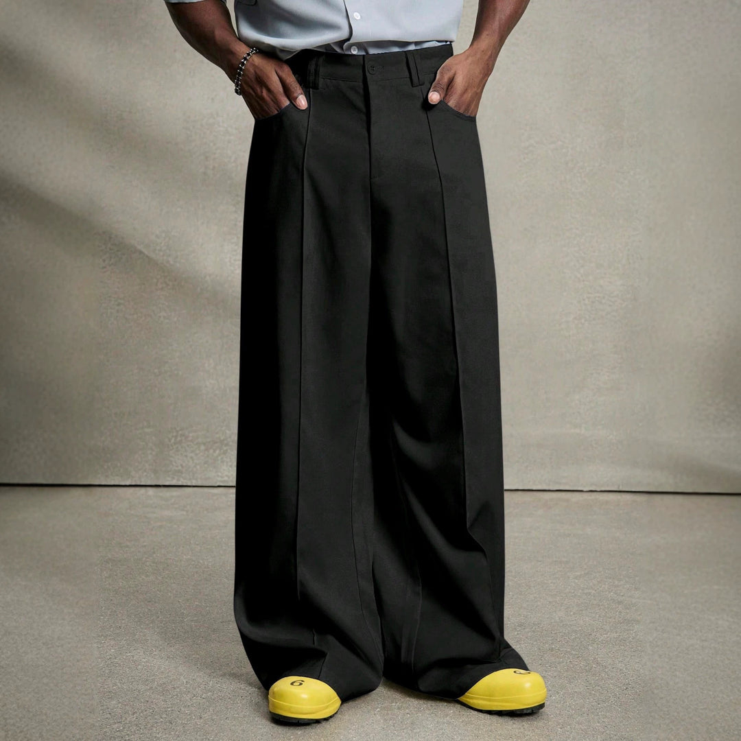 Men's wide pleated pants with high waistband, precise creases, and side inset pockets Mune Fashion