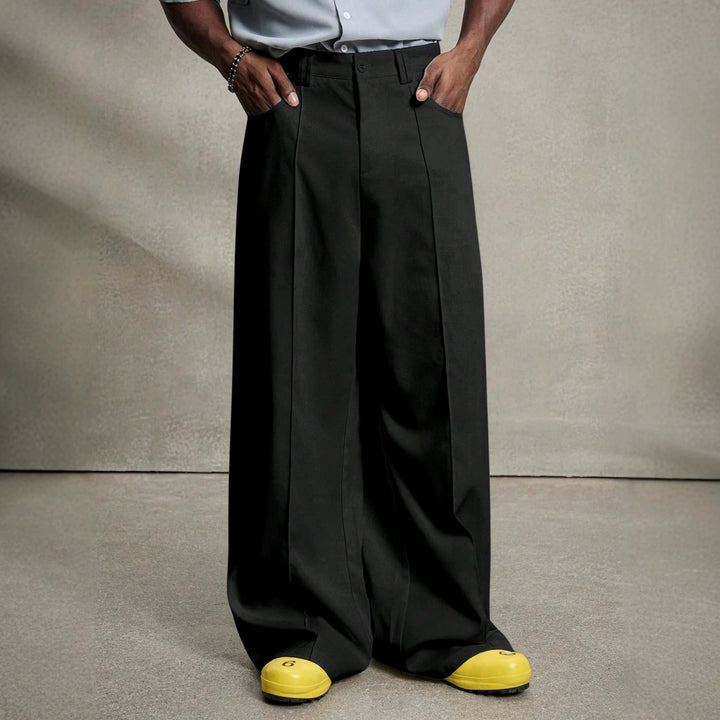 Men's wide pleated pants with high waistband, precise creases, and side inset pockets Mune Fashion