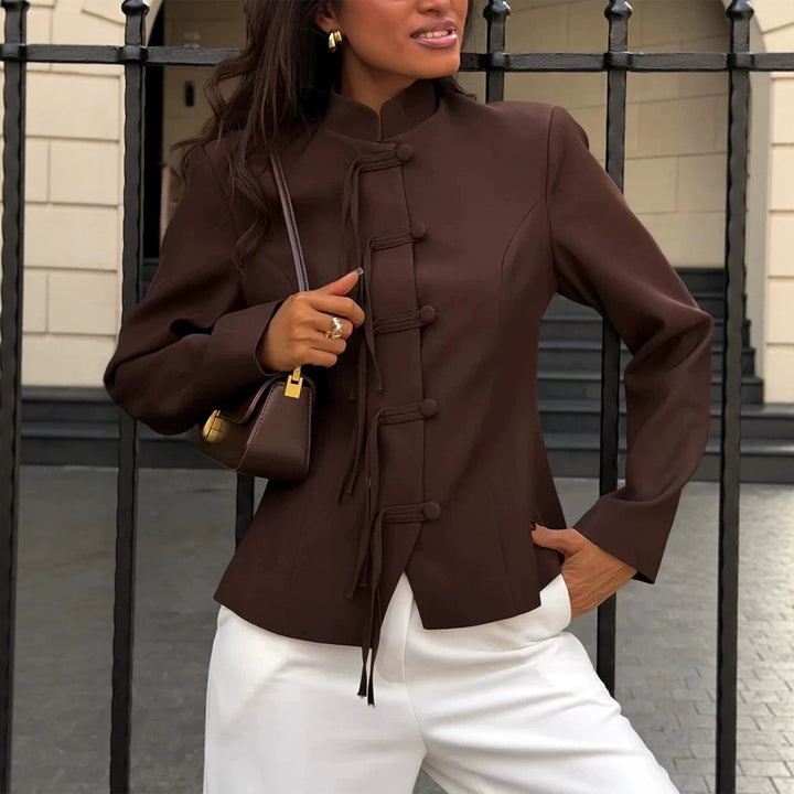 Women's fitted jacket with stand-up collar, Chinese knot fastenings, and slightly cropped cut.