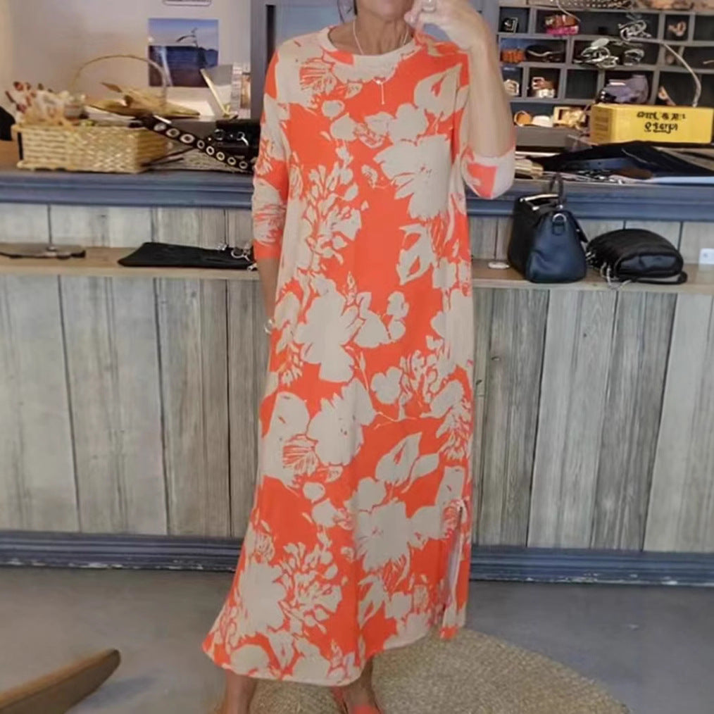 Women’s flowing A-line maxi dress with three-quarter sleeves round neckline side slit and inserted pockets Mune Fashion