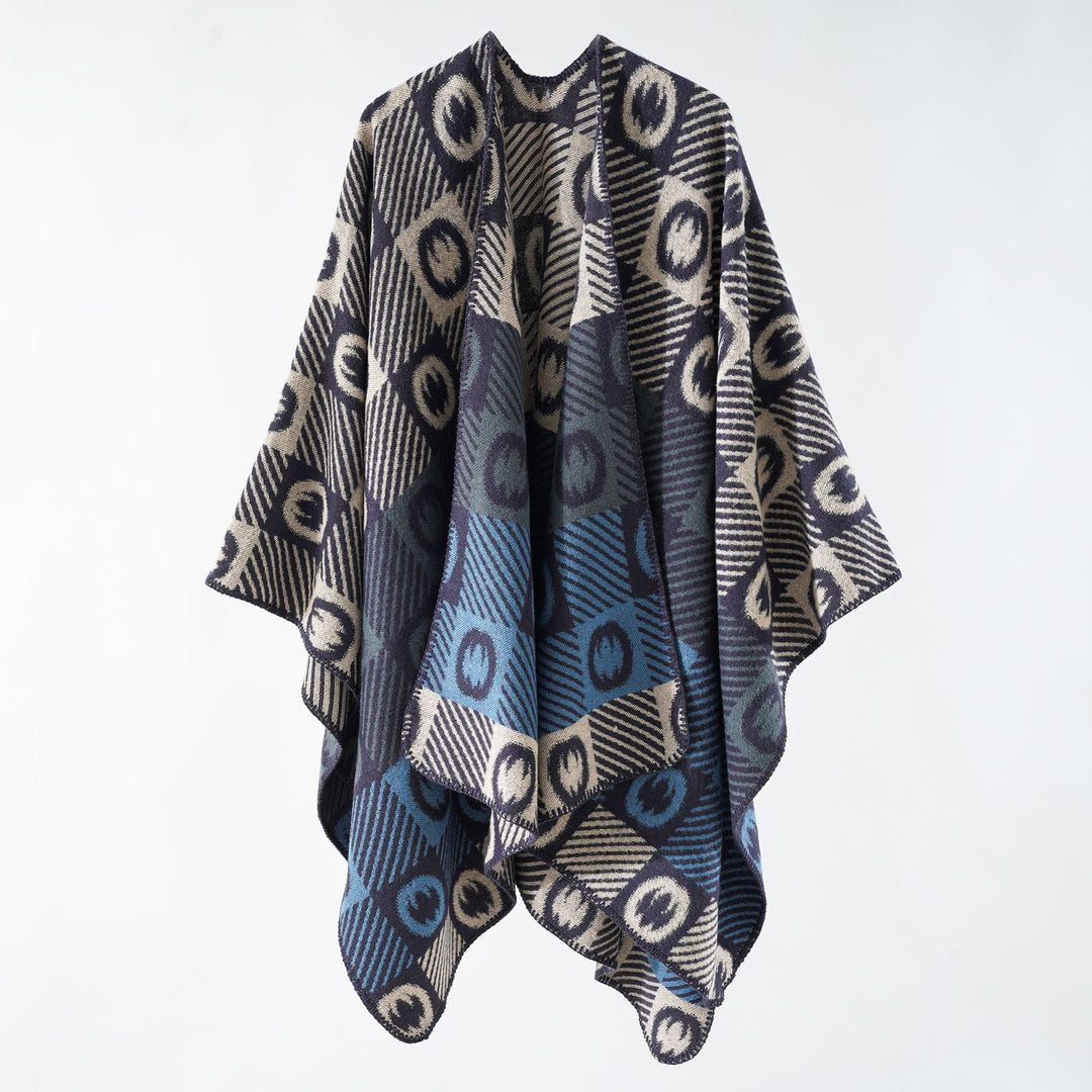 Women's jacquard wrap poncho made of fine knit with graphic circle jacquard and open kimono silhouette.