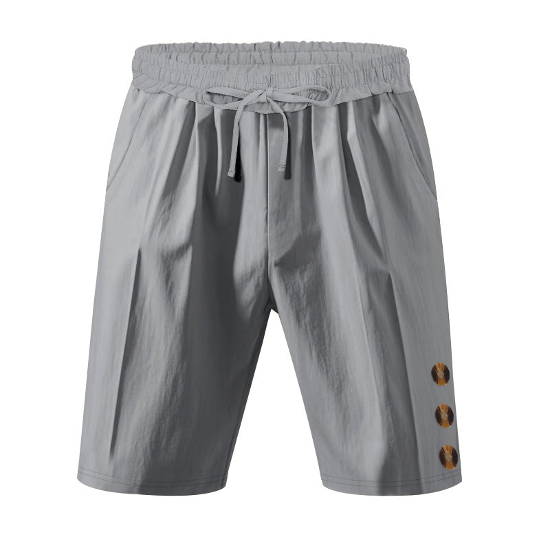 Men's knee-length casual Bermuda shorts with elastic tunnel drawstring waist, side slit pockets, and round decorative appliqués Mune Fashion