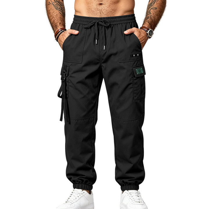Men's utility cargo pants in jogger style with elastic waistband, multiple pockets and leg straps Mune Fashion
