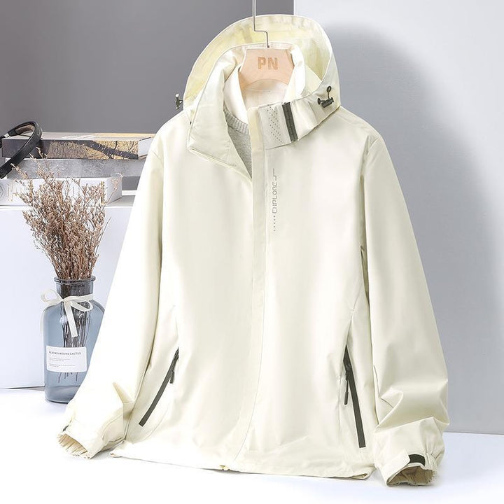 Women's Lightweight Softshell Hooded Jacket with Windproof Storm Flap and Concealed Zipper Pockets Mune Fashion