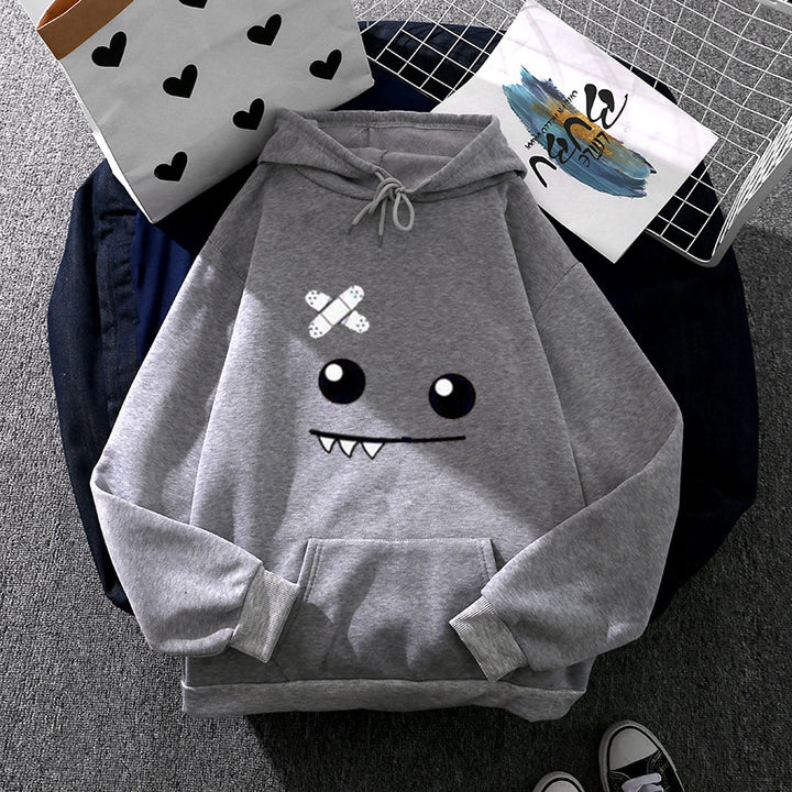 Women's hoodie with playful monster face, bandage application and kangaroo pocket Mune Fashion
