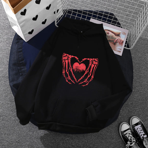 Women's stylish hoodie with skeleton hand heart motif and kangaroo pocket Mune Fashion