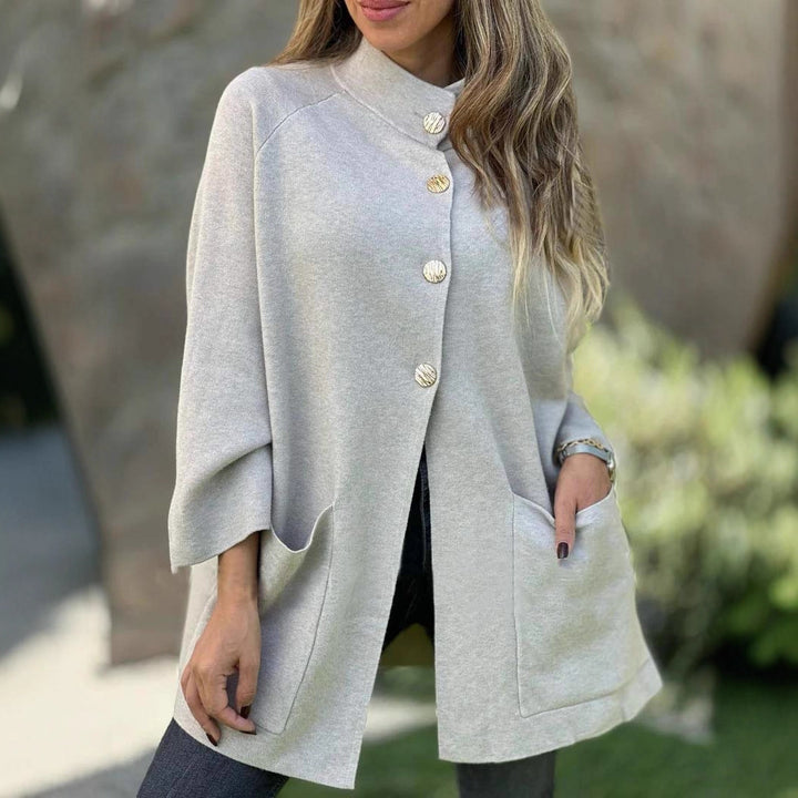 Women's Oversize Cape Cardigan with Stand-Up Collar, Patch Pockets, and Decorative Buttons Mune Fashion
