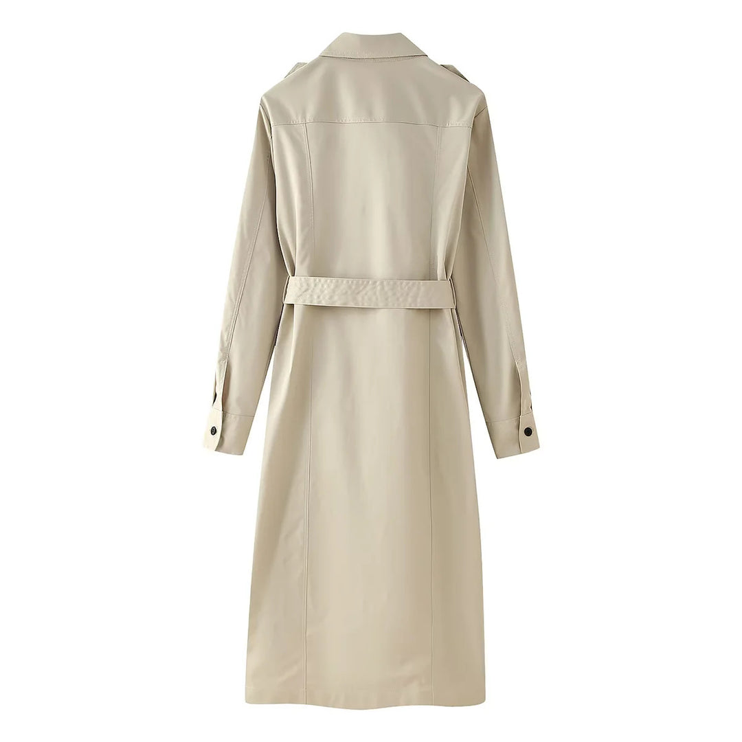 Women's longer tailored trench coat with waist belt, shoulder epaulettes, and continuous button placket Mune Fashion