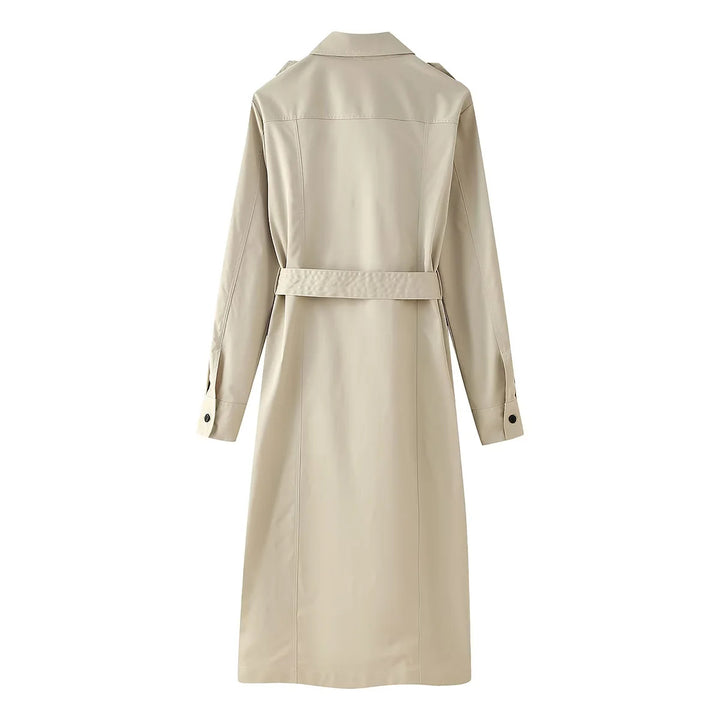 Women's longer tailored trench coat with waist belt, shoulder epaulettes, and continuous button placket Mune Fashion