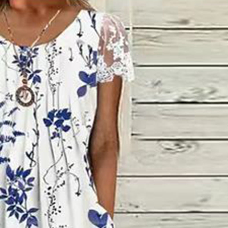 Ladies' airy A-line midi dress with lace sleeves, side pockets, and round neckline Mune Fashion
