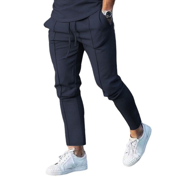 Men's Slim Tapered Jogging Pants with decorative stitching, elastic drawstring, and narrow ankle cuffs Mune Fashion