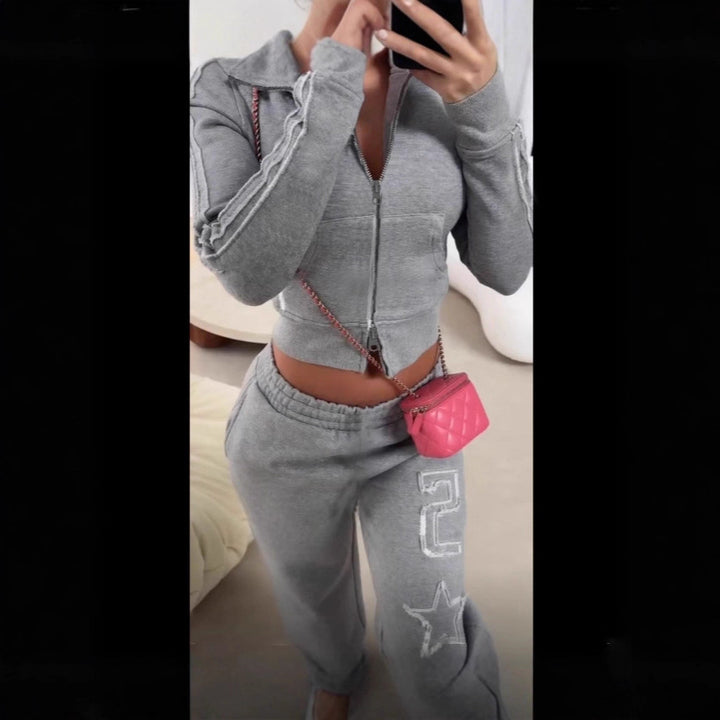 Women's tailored cropped hoodie with full zip, elastic hem, and decorative college print Mune Fashion