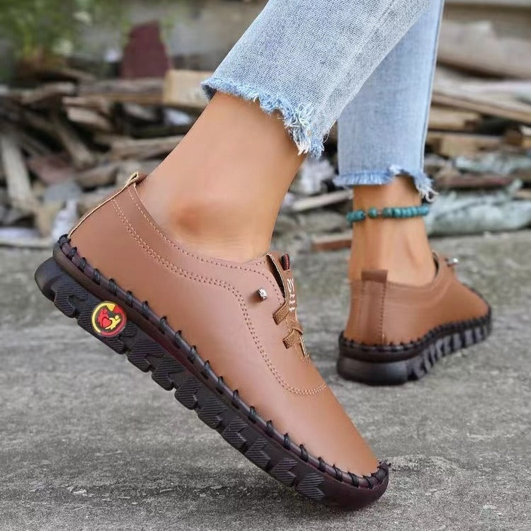 Women's hand-sewn moccasin loafers with elastic lacing, padded comfort insole, and patterned rubber sole Mune Fashion