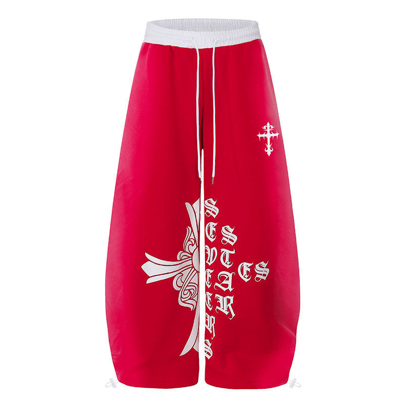 Women's extra-wide culotte sweatpants in palazzo style with a high comfort waistband, drawstring, and gothic cross print Mune Fashion