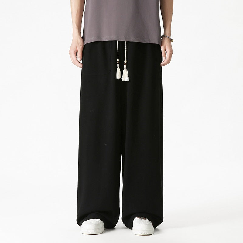 Men's loose-fitting lounge pants with tassel cord, elastic waistband, and patch pockets Mune Fashion