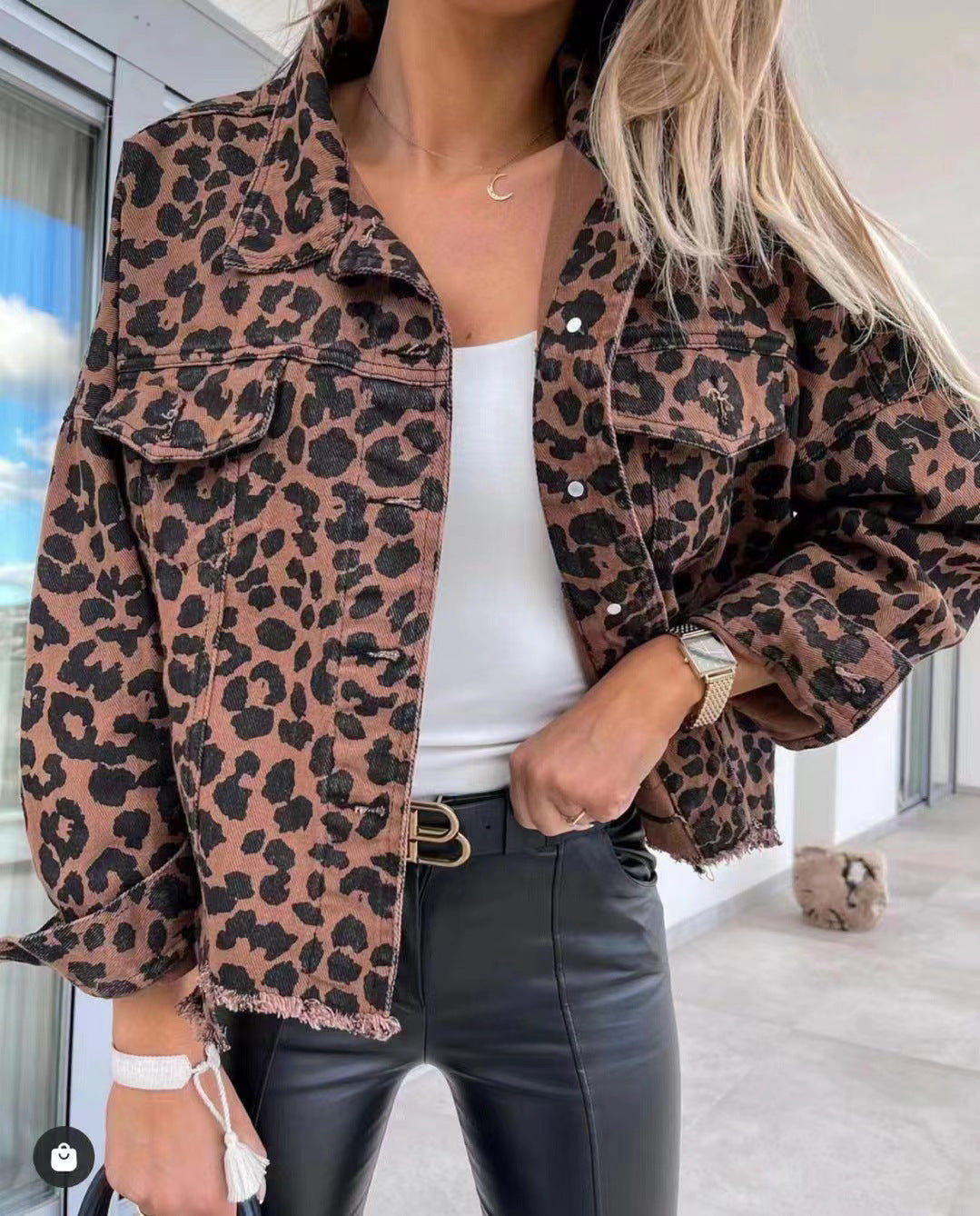 Women's cropped oversized denim jacket with leopard print, patch chest pockets, and raw hem Mune Fashion