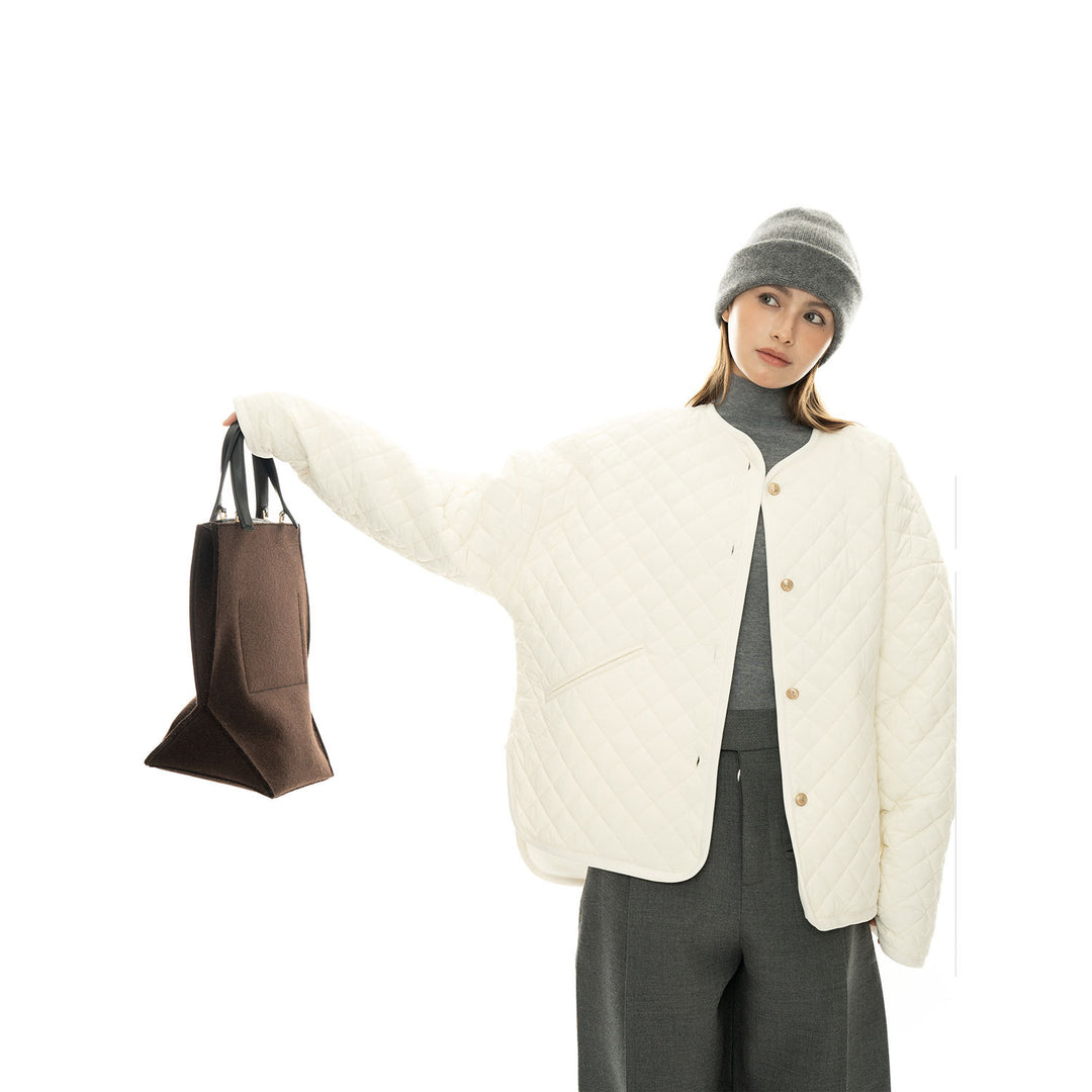 Women’s light padded oversized quilted jacket with round neckline and patch pockets Mune Fashion