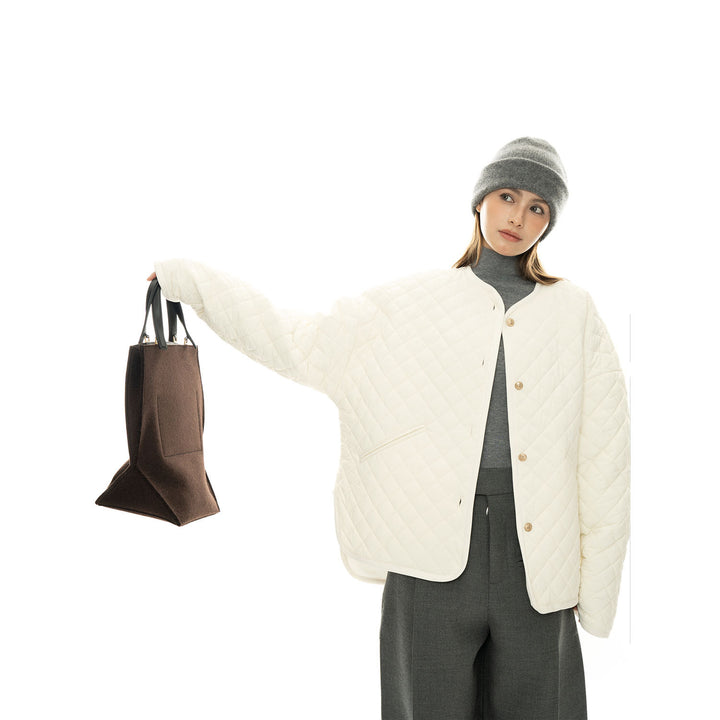 Women’s light padded oversized quilted jacket with round neckline and patch pockets Mune Fashion