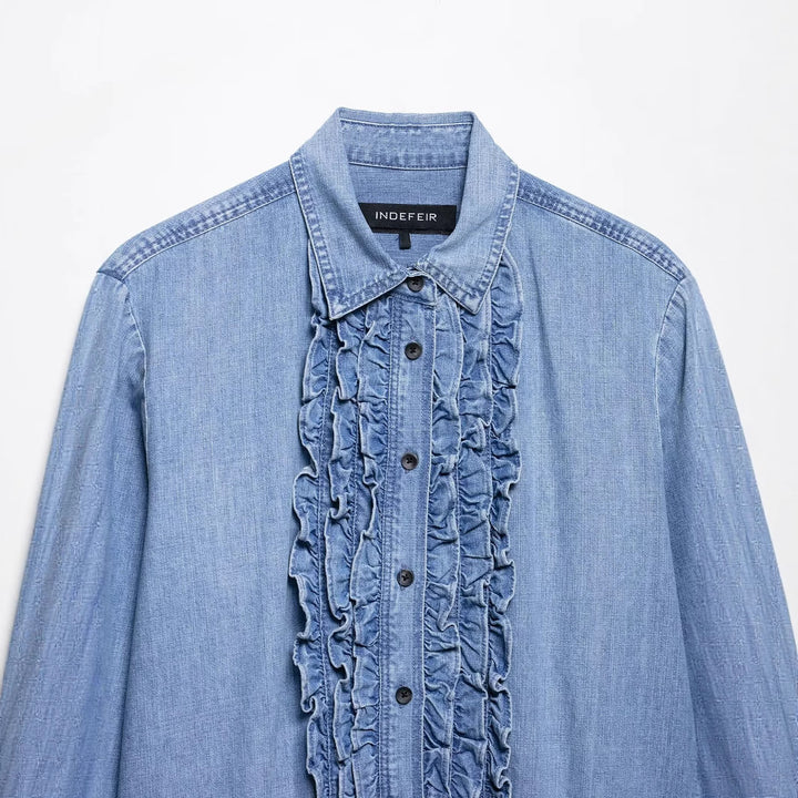Women's chambray blouse with ruffled button placket, shirt collar and extended hem Mune Fashion