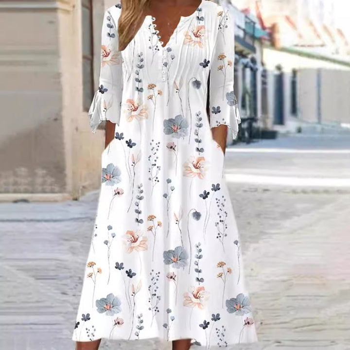 Women flowing midi dress with V-neck, decorative button placket, chest pleats, bow sleeves and side pockets Mune Fashion