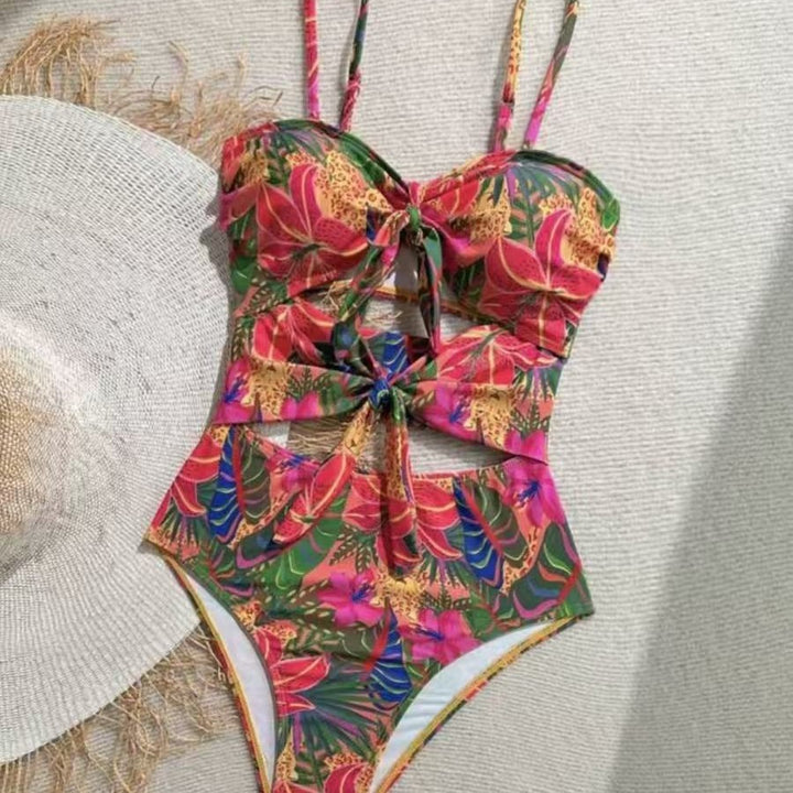 Women's one-piece swimsuit with decorative knot detail and playful floral design Mune Fashion