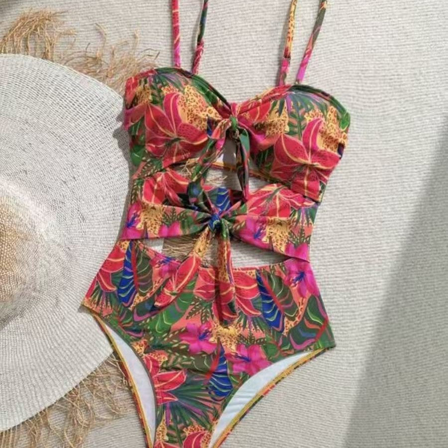 Women's one-piece swimsuit with decorative knot detail and playful floral design Mune Fashion