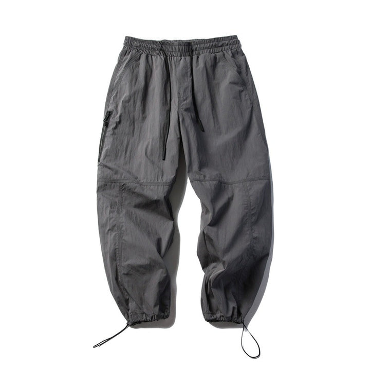 Unisex Technical Cargo Pants in Baggy Cut with Drawstring Waist and Adjustable Leg Closures Mune Fashion