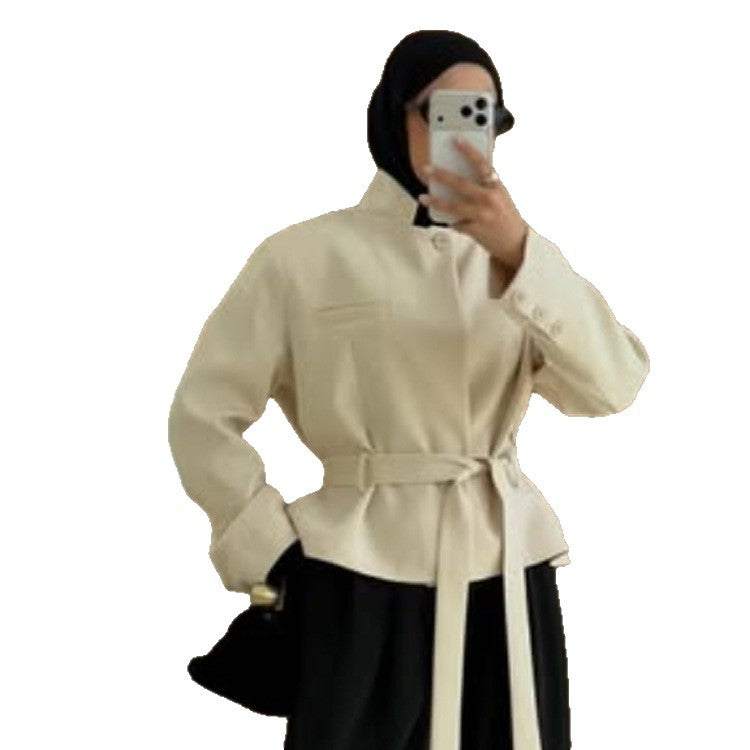 Women's tailored short blazer with standing collar, peplum, and tie belt Mune Fashion