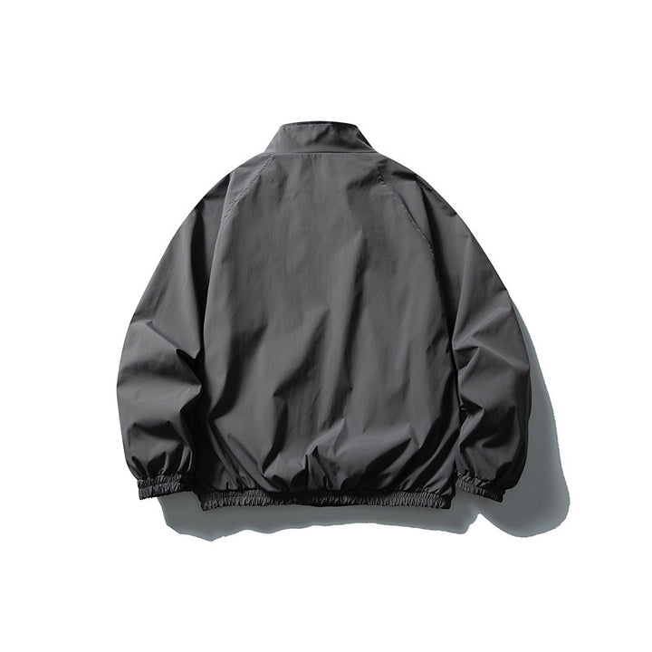 Unisex Lightweight water-repellent windbreaker with stand-up collar, raglan sleeves, and elastic hem Mune Fashion