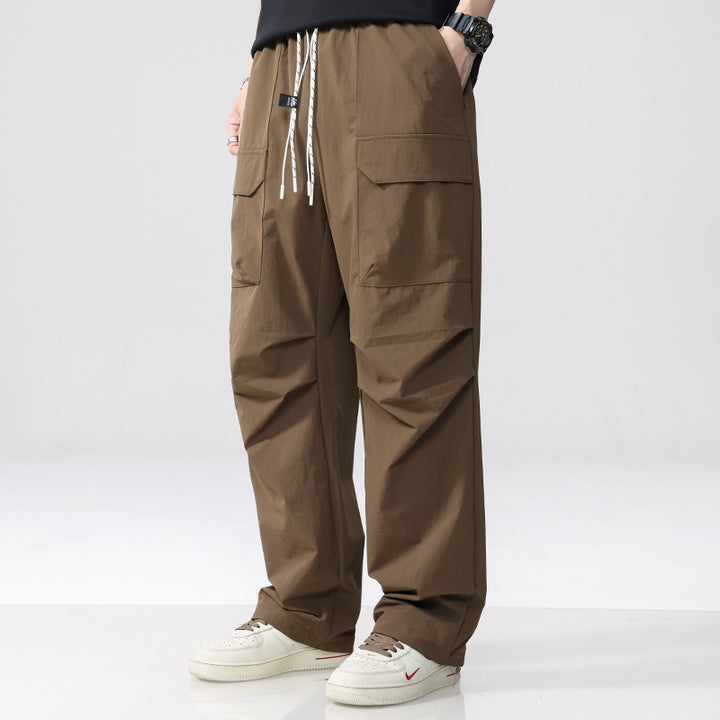 Men's Oversized Cargo Pants made of lightweight functional fabric with drawstring waistband and multiple pockets Mune Fashion