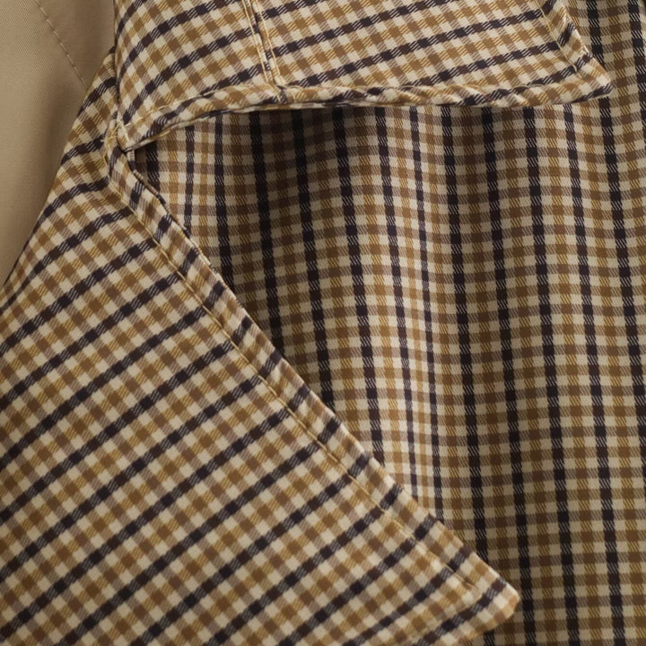 Women's short trench coat in checkered pattern with waist belt, shoulder straps and quilted inner lining Mune Fashion