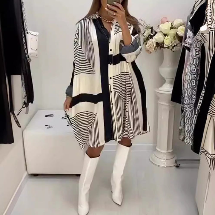 Women's knee-length A-line shirt dress with graphic line print, concealed button placket, and oversized cuffs Mune Fashion