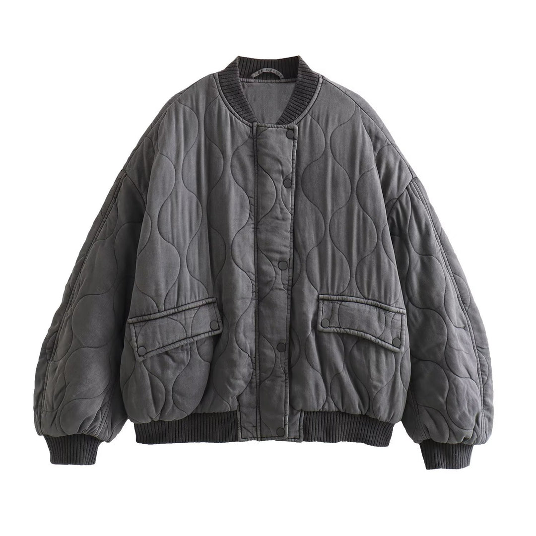 Women's quilted bomber jacket with oversized silhouette, ribbed cuffs, and flap pockets Mune Fashion