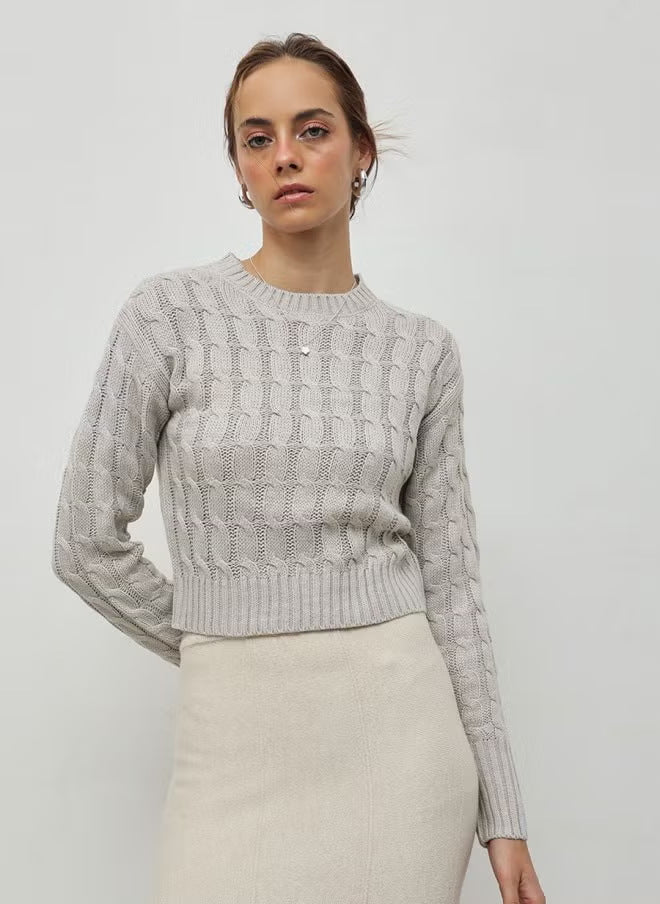 Women's short-cut braided knit pullover with round neckline and ribbed cuffs Drune