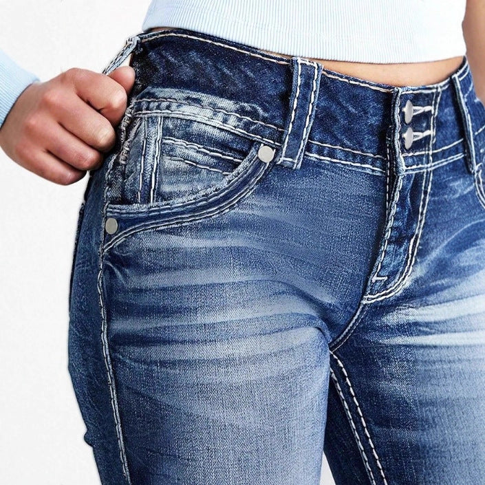 Women's high-waisted bootcut jeans with shaping waistband and visible button placket Mune Fashion