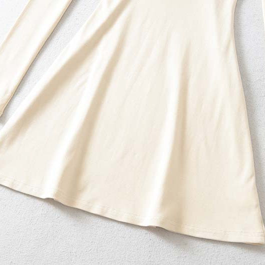 Ladies form-fitting mini dress with a deep V-neckline, gathered bust, and crossed back straps Mune Fashion