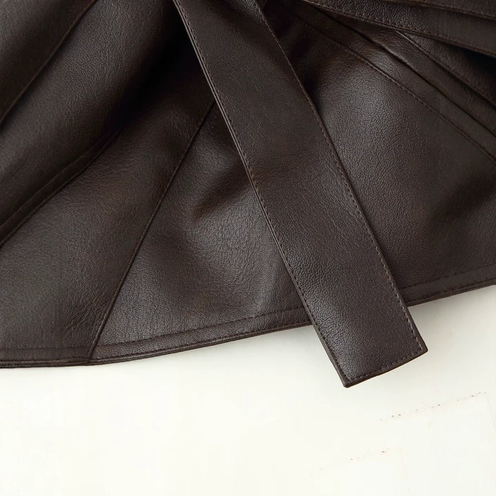 Women short jacket made of faux leather with long faux fur sleeves and tie belt Mune Fashion