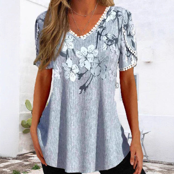 Women's nan legeres V-neck tunic shirt with floral pattern and pompom trim Mune Fashion