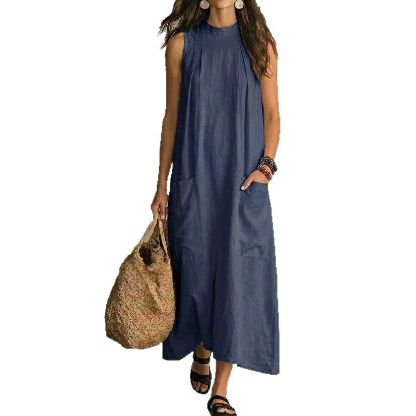 Women’s sleeveless linen maxi dress with standing collar, pleats at the chest, and piled pockets Mune Fashion