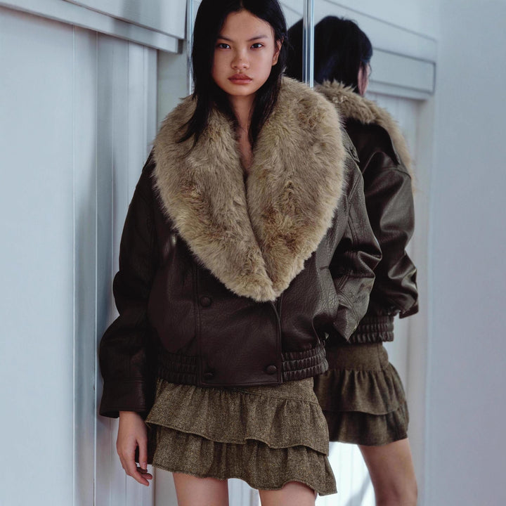 Women's short-cut bomber jacket made of leather look with voluminous faux fur collar Mune Fashion
