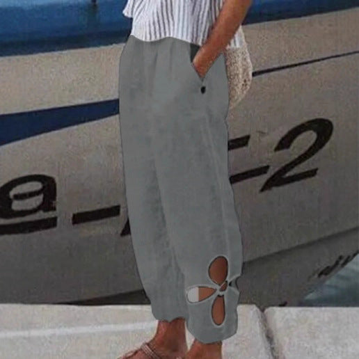 Women's ankle-length culotte pants with elastic waistband, side pockets, and floral hem cutout Mune Fashion